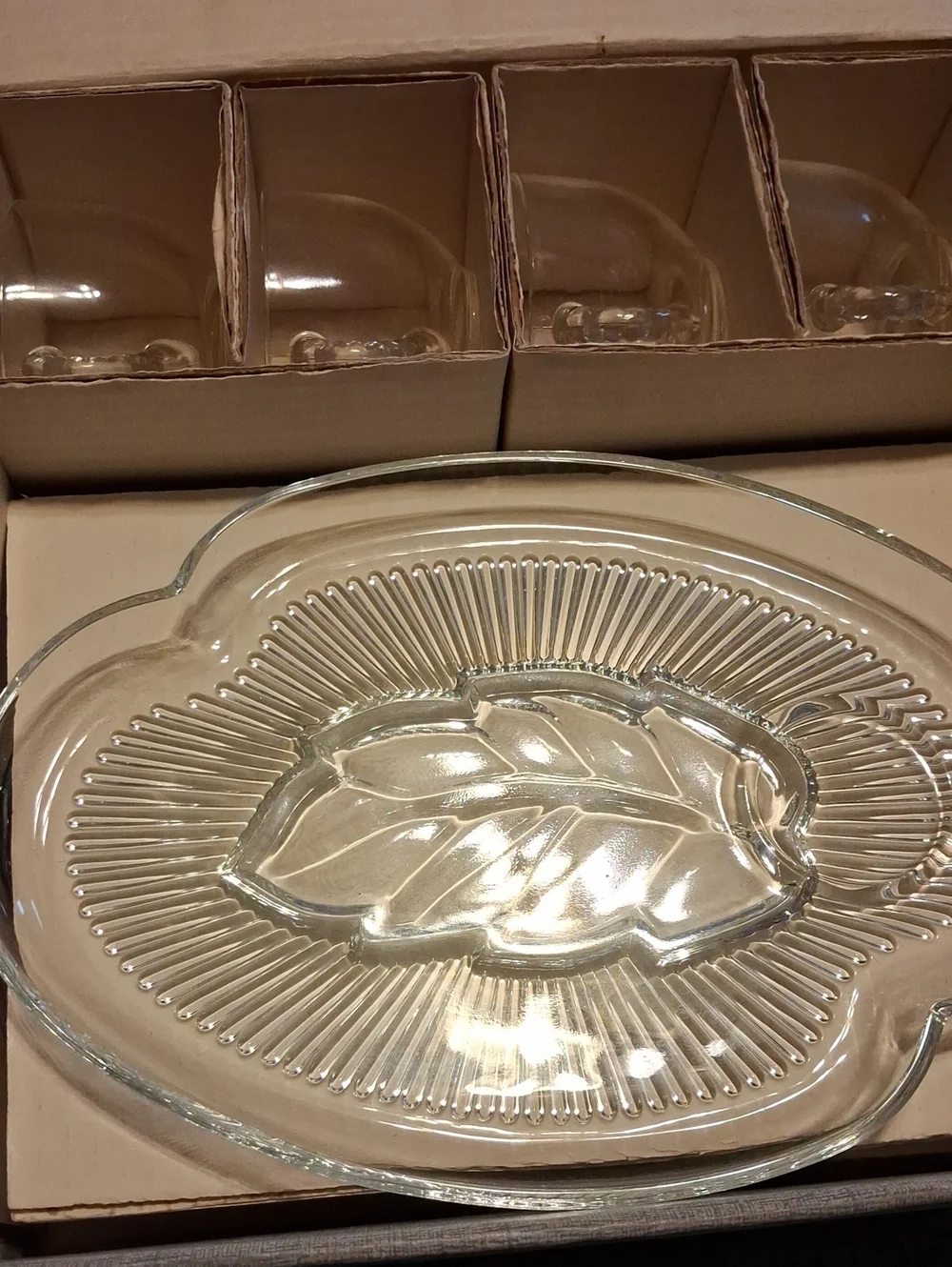 Four Glass Plates And Four Glass Cups